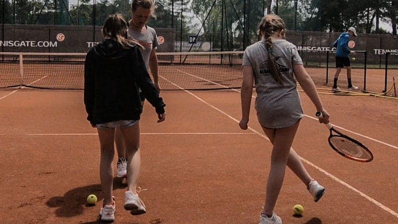 Dribbling the tennis ball with the feet